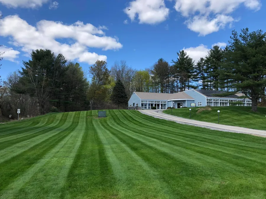 Professional lawn mowing with clean lines in Concord NH